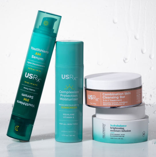 USRx skincare products including serum, moisturizer, and cleansing bar on a light background