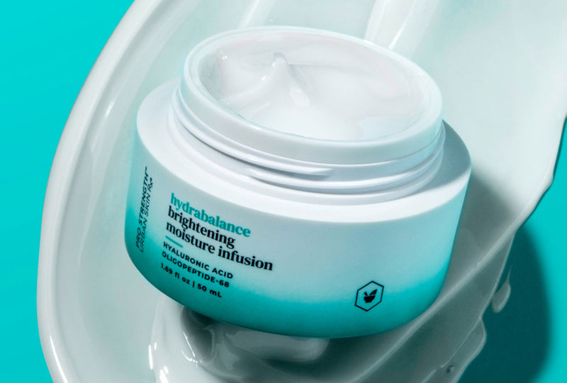 Skincare jar labeled 'hydrabalance' on a teal background