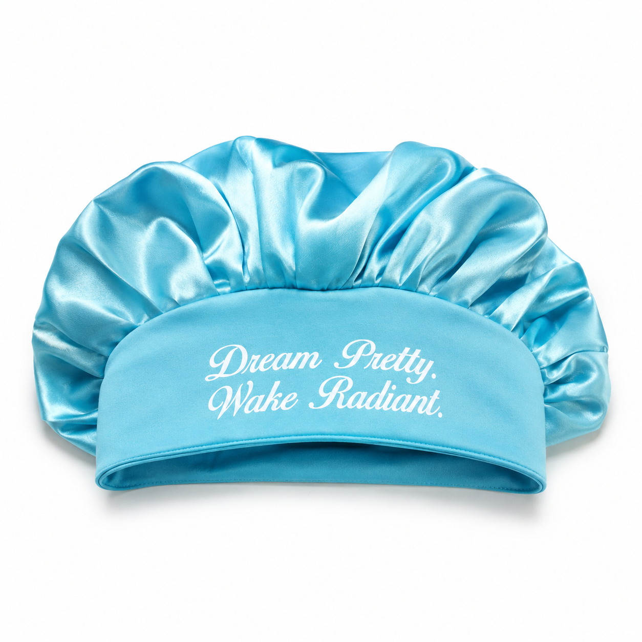 Blue satin bonnet with the words "Dream Pretty, Wake Radiant" printed on it