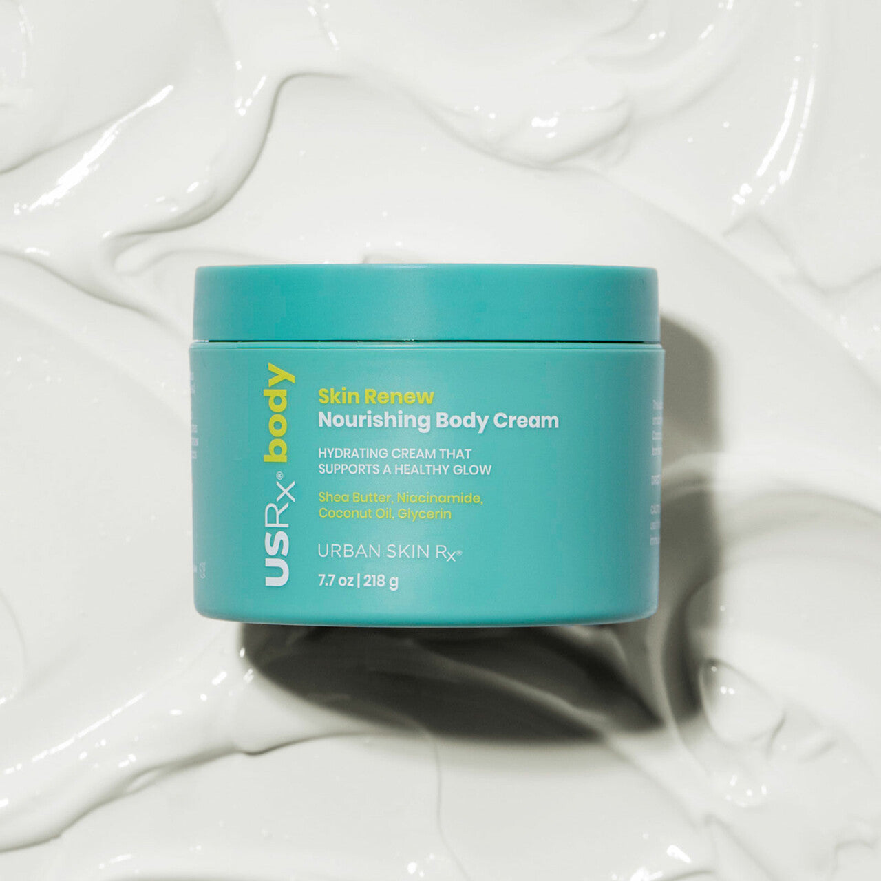 7.7 oz jar of USRx Skin Renew Nourishing Body Cream on a background swatch of white creamy product