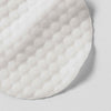 Textured white cotton pads provide extra exfoliation