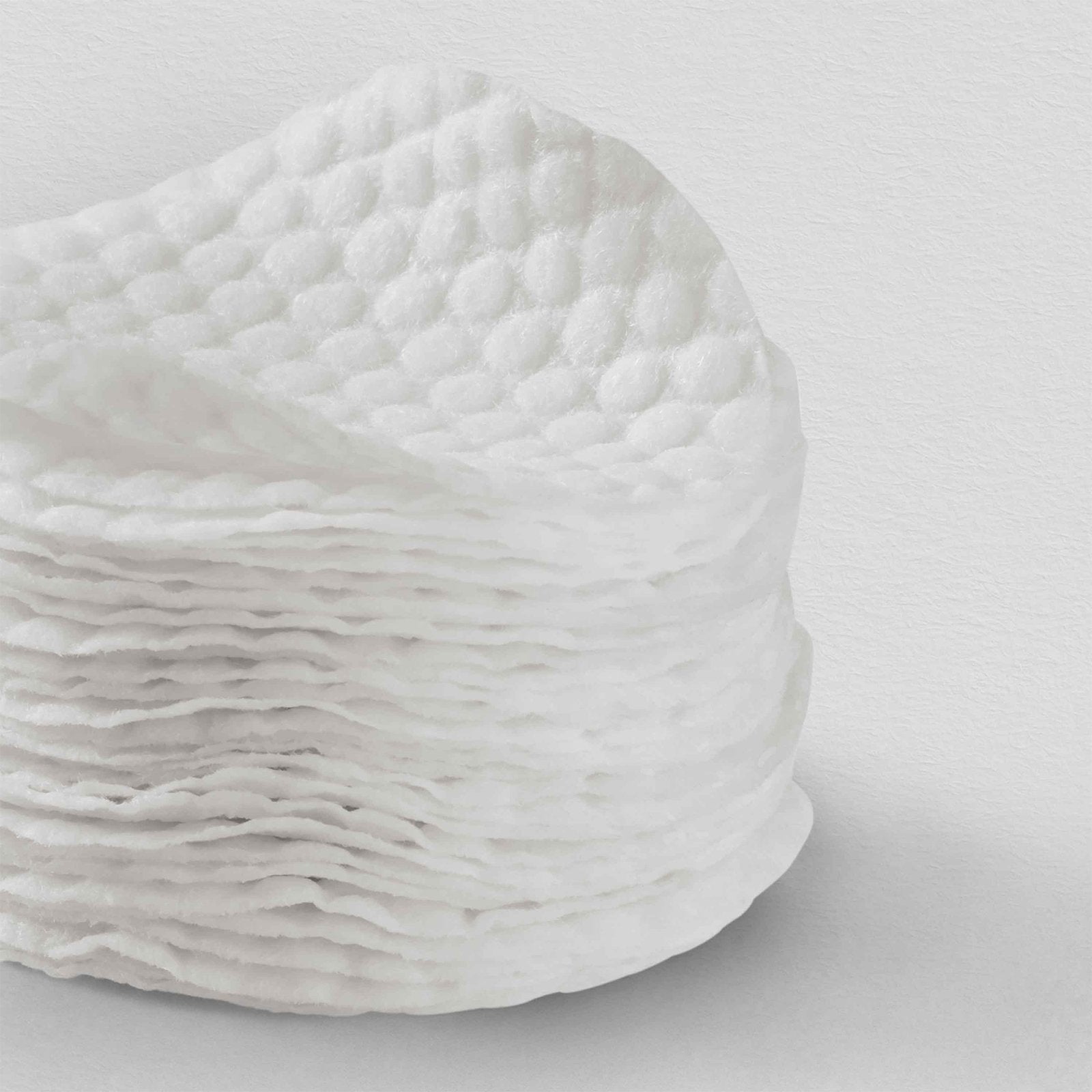 textured round pads come soaked in a white/off-white solution that feels cool on contact.