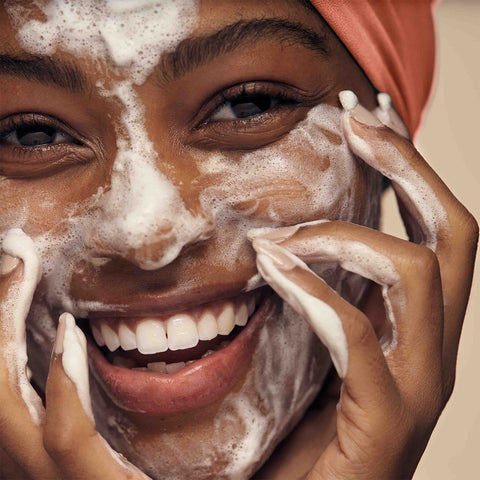 Diverse model enjoying the lathering foam of the Combination Skin Cleansing Bar