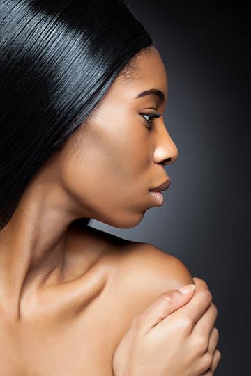 Side profile of an African American woman of deep complexion 