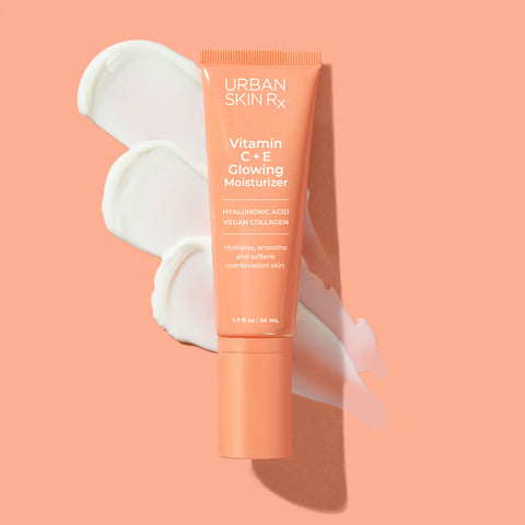 Bottle of Urban Skin RX Vitamin C + E Bright Glowing Moisturizer with a swatch of product on a pale pink background 