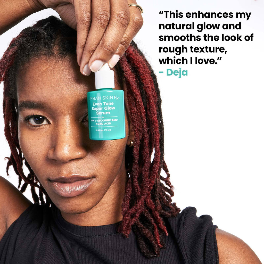 Woman holding bottle of USRX Even Tone Super Glow Serum