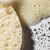 Close up of Urban Skin RX Even Tone Cleansing Bar showing texture of cleansing bar and soap suds