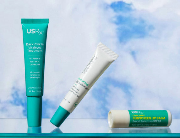 Set of USRx lip products on a light blue background 