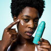 Woman applying Urban Skin Rx Complexion Protection Moisturizer to her face