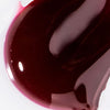 Swatch of USRx Hydrating Lip Treatment in Juicy shade