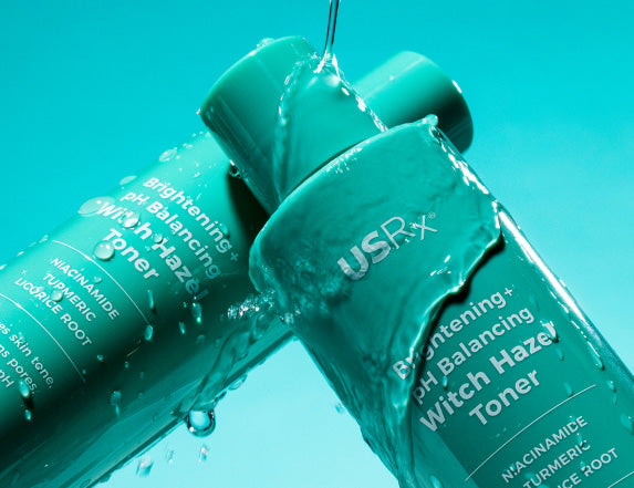 2 bottles of USRx Witch Hazel Toner on a light blue background