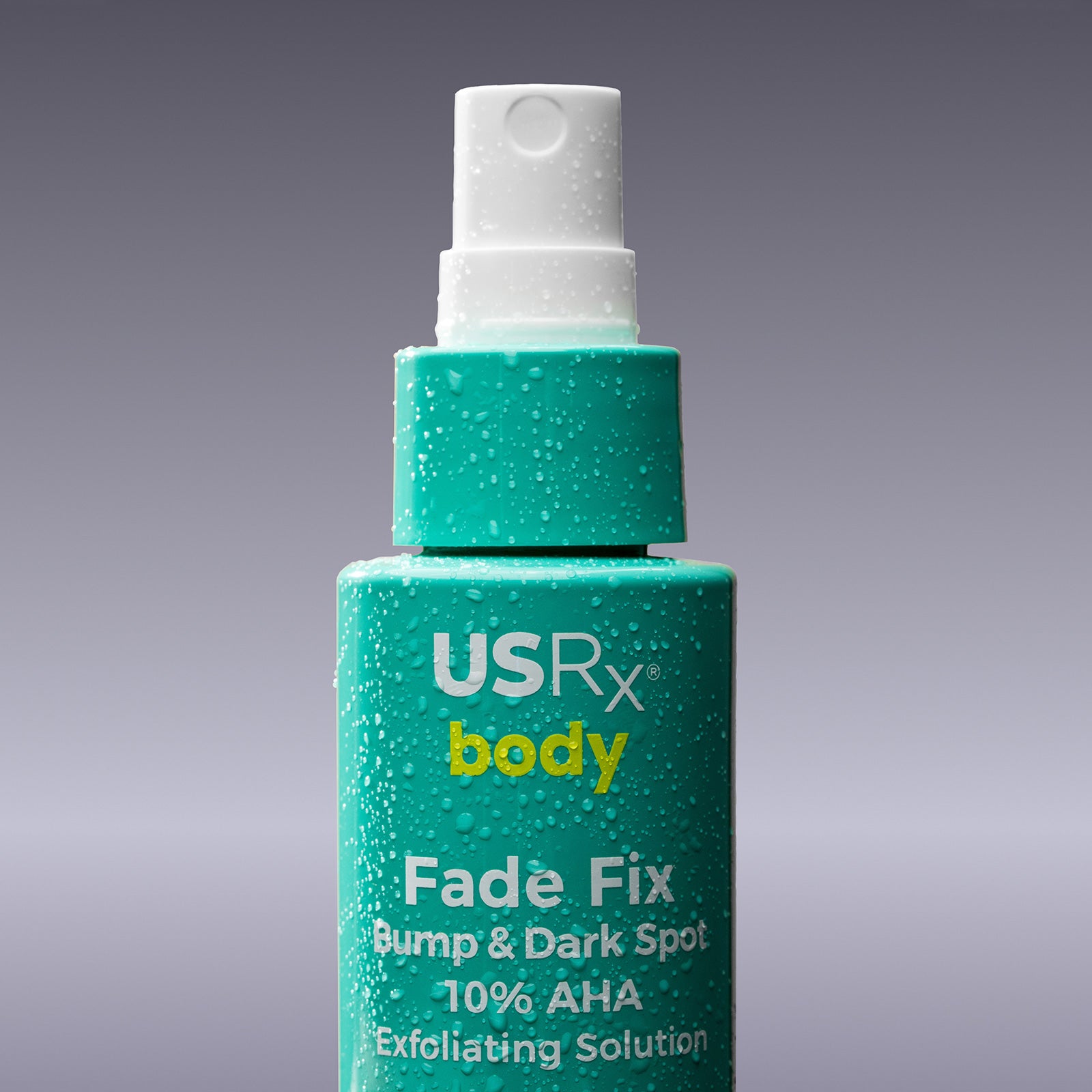 Bottle of USRx Fade Fix exfoliating solution a grey background