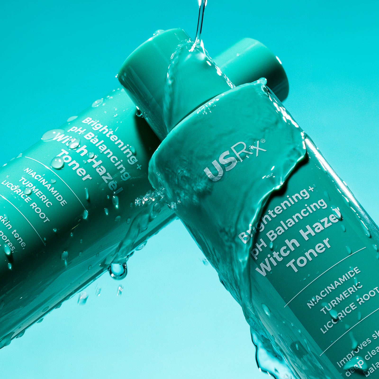 Two bottles of USRx Witch Hazel Toner on a light blue background