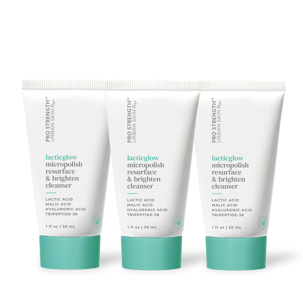 Three bottles of USRx Mini LacticGlow Cleanser on a white background