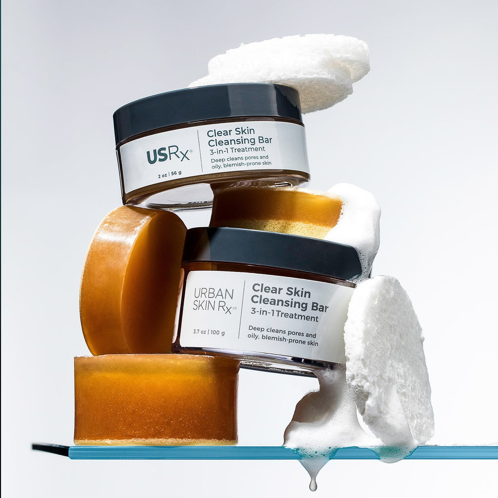 Two jars of USRx Clear Skin Cleansing Bar on a white backround