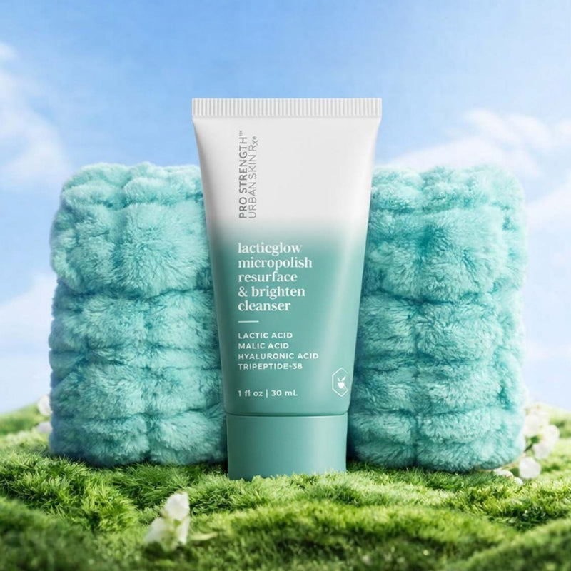 Bottle of USRx LacticGlow Cleanser  and wrist cuffs on a light blue background