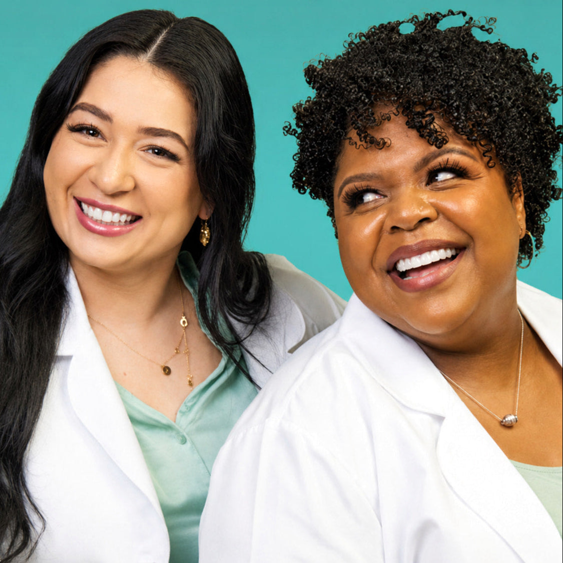 Two USRx licensed estheticians in white lab coats against a light blue background