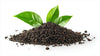 Black tea leaves on a white background