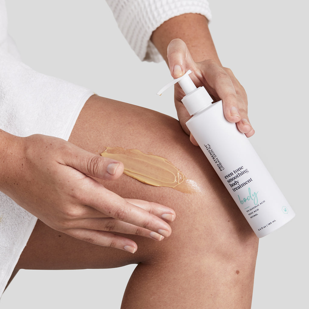 Woman applying Urban Skin RX Even Tone Smoothing Body Treatment on her leg