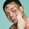 Man washing his face with Urban Skin RX Men's Exfoliating Face Wash + Scrub 