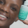 Woman using Urban Skin RX Super C Brightening Serum on her face